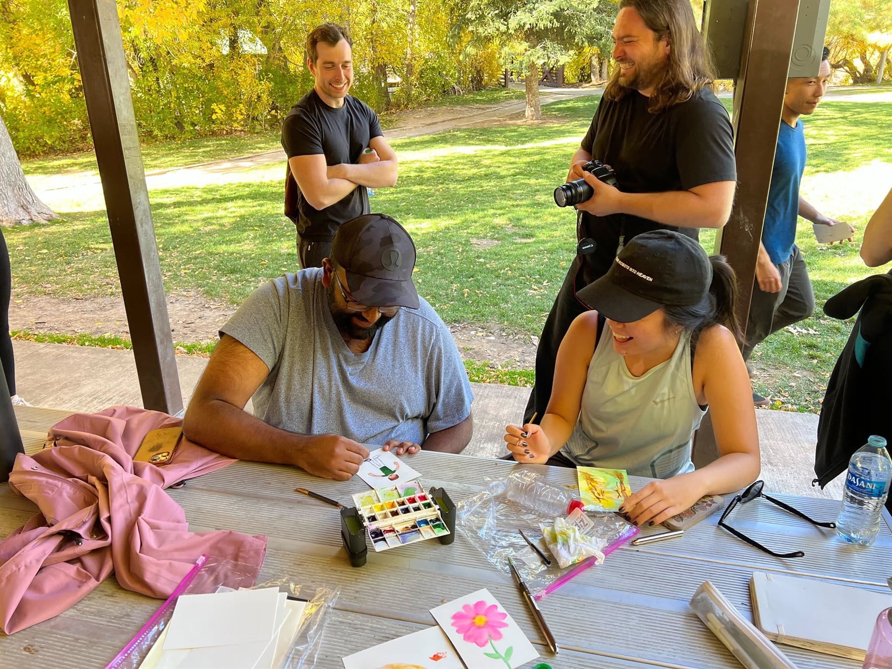 Team members making art together